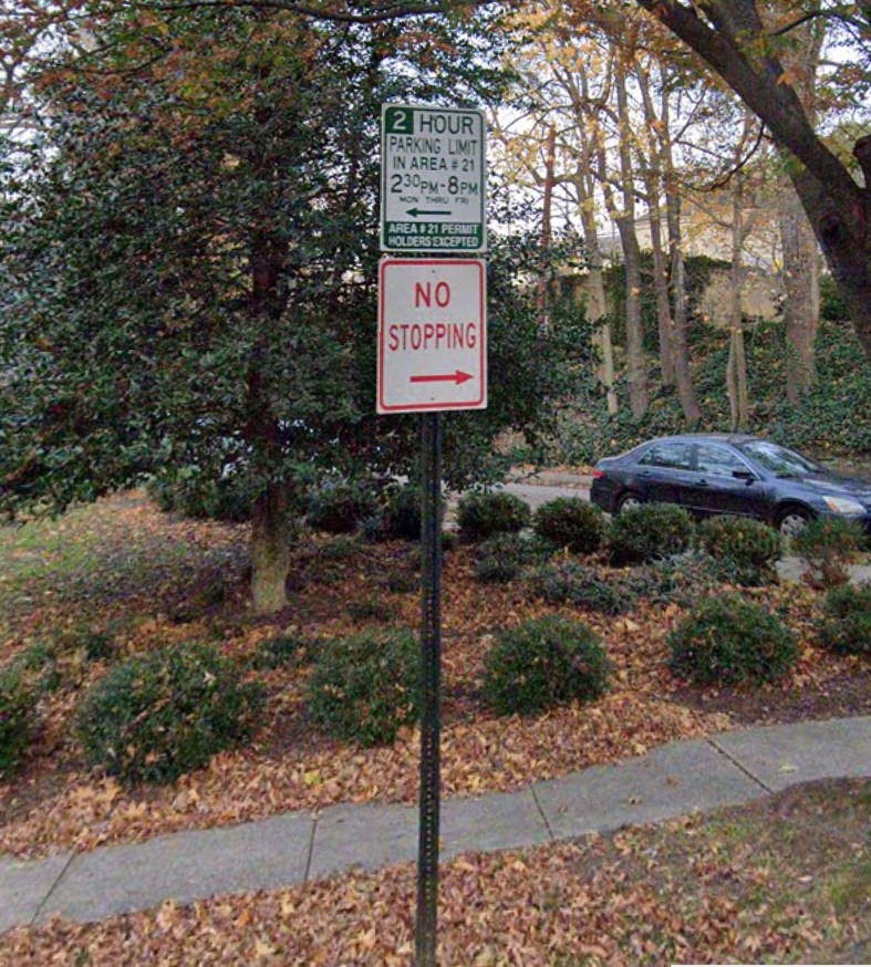 Regulatory Signs with trees and sidewalk